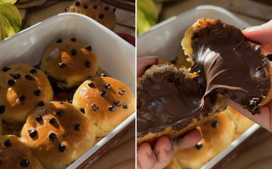 Golden brioche buns with chocolate chips, one torn open with Nutella spread inside